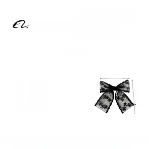 Detail showing an elegant black lace bow hair clip measuring 16cm in total width