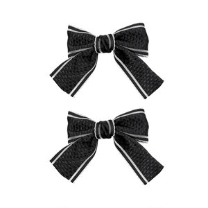 Elegant black ribbon hair clips with white scalloped lace edges and wavy lace trim style