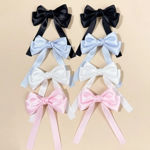 Elegante Schleifen-Haarspangen aus Satin in Schwarz Blau Weiß und Rosa im 4er-Set