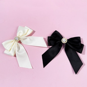 British vintage bow tie accessory with rhinestones and pearls on cream and black satin