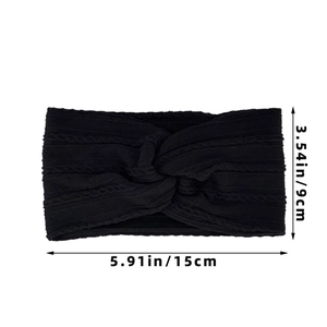 Elastic black cable knit baby headband with twist design measuring 9cm by 15cm
