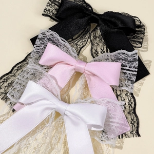 Elegant lace and satin bow hair clips in black, pink, and white colors for women