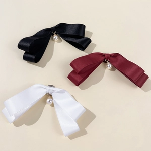 Elegant satin bow tie pins set with pearl pendants in black, white, and wine red