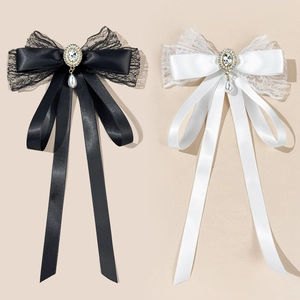 Elegant lace bow pins with rhinestones and pearl pendants in black and white styles