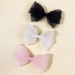 Elegant triple-layer organza bow hair clips in black, white, and pink colors