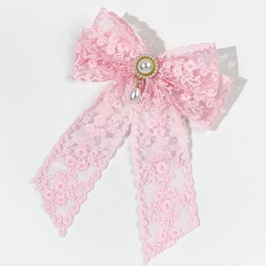 Elegant pink lace bow hair clip with central pearl cluster and teardrop pendant
