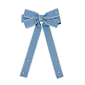 Vintage blue denim bow hair clip with gold stars and scalloped white edges