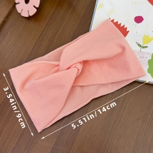 Peach pink elastic baby headband with twisted knot design and 3.54 x 5.51 inch dimensions
