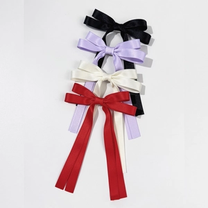 Elegant satin bow hair clips in black, lavender, beige and red with long trailing ribbons