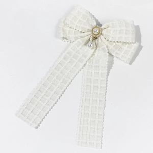 Elegant white lace bow hair clip with pearl pendant and classic plaid texture
