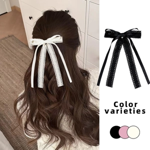 Barrette à cheveux élégante avec dentelle et longs rubans blancs et noirs