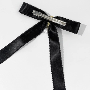 Elegant black satin bow hair clip with pearl pendant and metal alligator clip