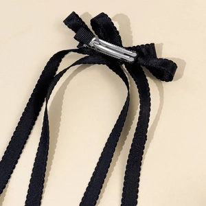 Fermaglio per capelli stile balletto con fiocco nero, bordi ondulati e clip a becco