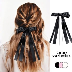 Pince à cheveux élégante avec nœud à pampilles en strass et longs rubans noirs
