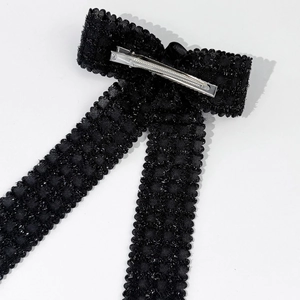 Elegant black bow hair clip with silver glitter texture and metal duckbill clasp