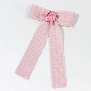 Pink tweed bow hair clip with satin rose detail and elegant long ribbons for women