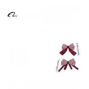 Detail showing dimensions of red houndstooth bow hair clips with measurement annotations