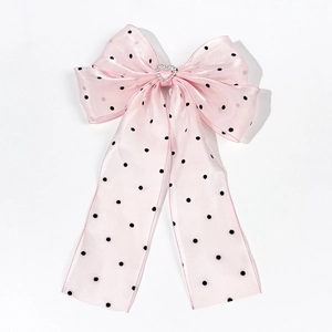 Elegant pink polka dot organza hair bow clip with a sparkly crystal heart center