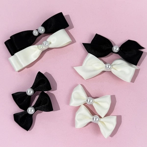 Ensemble élégant de barrettes à nœuds en satin avec perles en noir et blanc