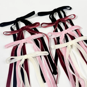 Elegant velvet bow hair clips with long streamers in black, red, pink, and cream white