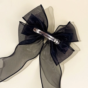 Elegant black layered mesh bow hair clip with pearl tassel and metal spring clasp
