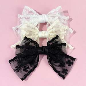 Set of three large lace bow hair clips in white, beige, and black with elegant embroidery
