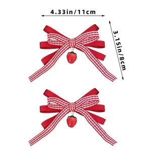 Detailed view of red plaid strawberry hair clips with 11cm width and 8cm height markers