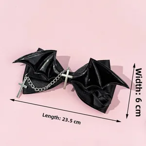 Gothic black bow hair clip with bat wings and cross pendant, 23.5cm long detail view