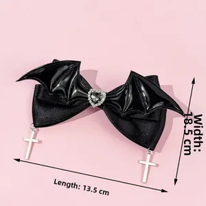 Gothic black satin hair bow with silver cross pendants and bat wings, 13.5x18.5 cm