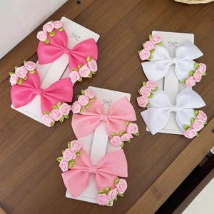 Three pairs of sweet flower bow hair clips for girls in pink and white tones