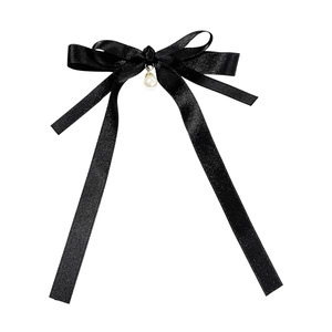 Elegant black satin bow hair clip with a centered white pearl and golden metal accent