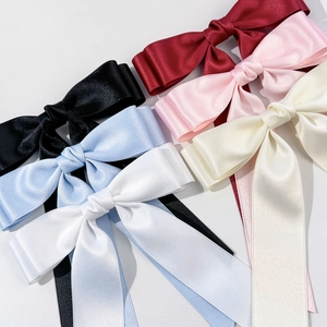 Barrettes à nœuds élégantes en satin six couleurs avec longs pompons pour femmes