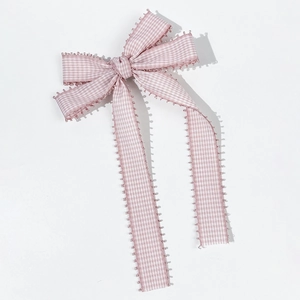Pink plaid checkered bow hair clip with scalloped lace edges on a white background