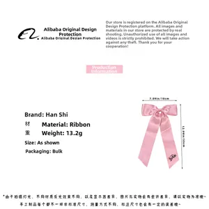 Pink satin bridal bow hair clip with Bride embroidery measuring 18x33cm 13.2g