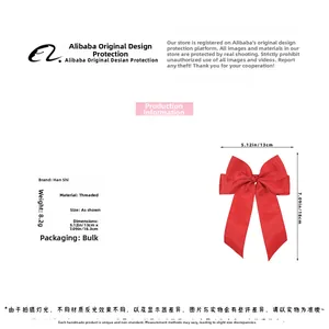 Dettaglio del grande fiocco per capelli in nastro grosgrain rosso da 13x18 cm