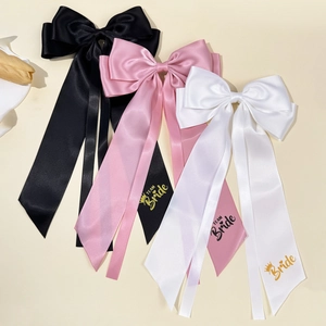 Elegant satin bow hair clips for bridesmaids with TEAM Bride gold lettering in three colors