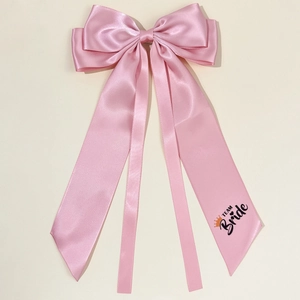 Pink satin bow hair clip with Team Bride streamers for bridesmaids and wedding parties