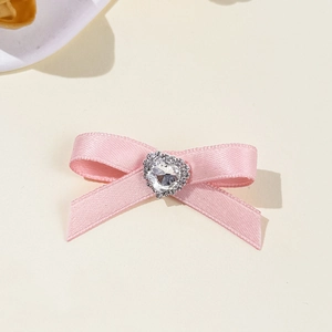 Sweet pink satin ribbon hair clip with a sparkling rhinestone heart in a cute ballet style