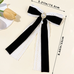 Detail view of velvet lace bow clip with elegant pearls and precise dimension markers