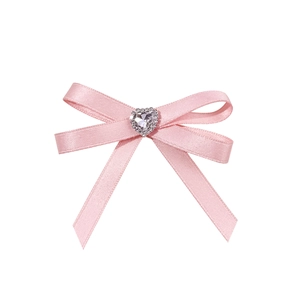 Pink satin bow hair clip with a sparkling rhinestone heart center for ballet style