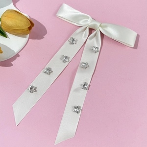 Elegant white satin hair bow clip with sparkling silver star rhinestones for women
