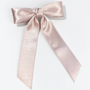 Elegant champagne pink satin ribbon hair clip with silk gloss and long flowing tails