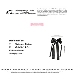 Detail einer schwarzen Schleifen-Haarspange mit Herz-Strass und Größenangaben