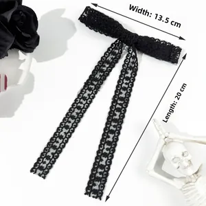 Lace bow hair clip with gothic tassels measuring 13.5cm wide and 20cm long