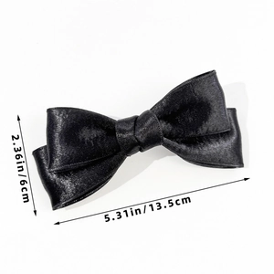 Detailed size measurement of a French black satin bow hair clip with elegant glossy finish