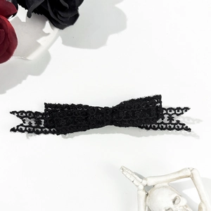 Gothic style black lace bow hair clip with vintage rose and skull accessory decor