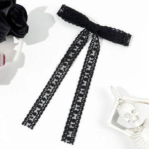 Gothic black lace bow hair clip with long tassels for women on minimalist white background