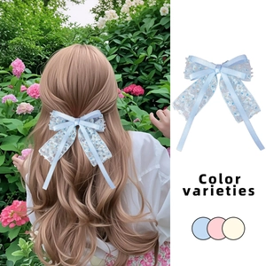 Fiocco per capelli in pizzo floreale azzurro con lunghi nastri per uno stile estivo elegante
