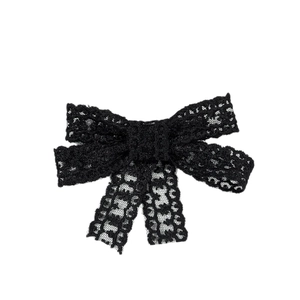Elegant black lace bow hair clip featuring intricate floral patterns and flowing ribbons