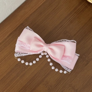 Sweet pink silk bow hair clip with white lace trim and elegant pearl tassel charm